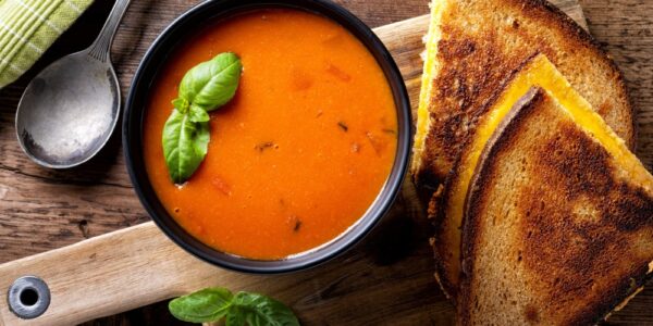 Delicious homemade tomato soup with a grilled cheese sandwich on rye.