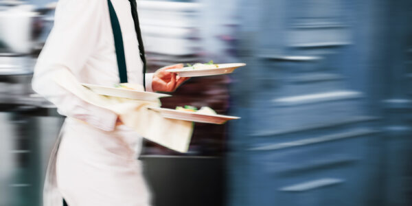 Waiter,Serving,In,Motion,On,Duty,In,Restaurant,Long,Exposure